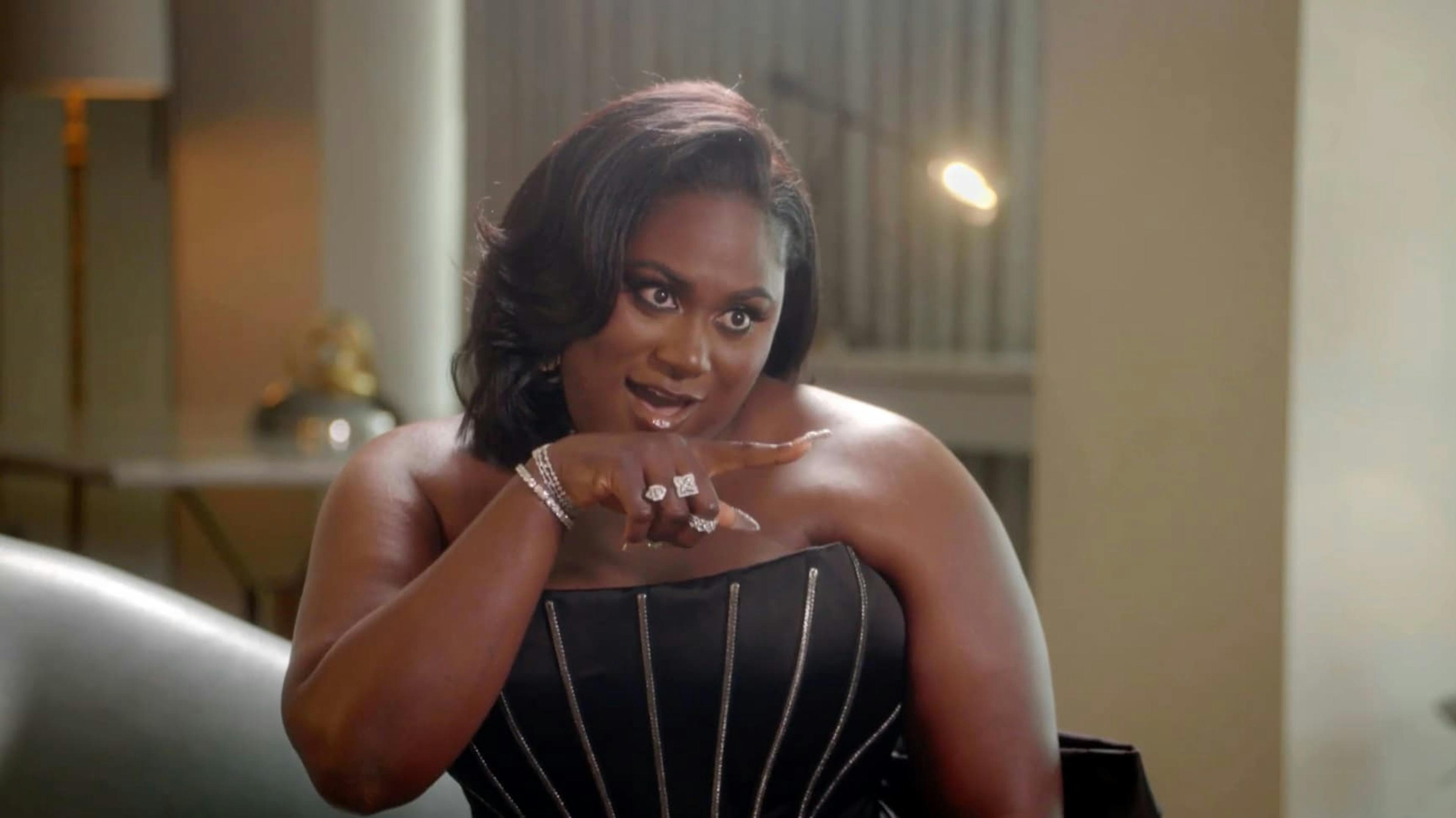 Girl pointing with jokey shocked expression