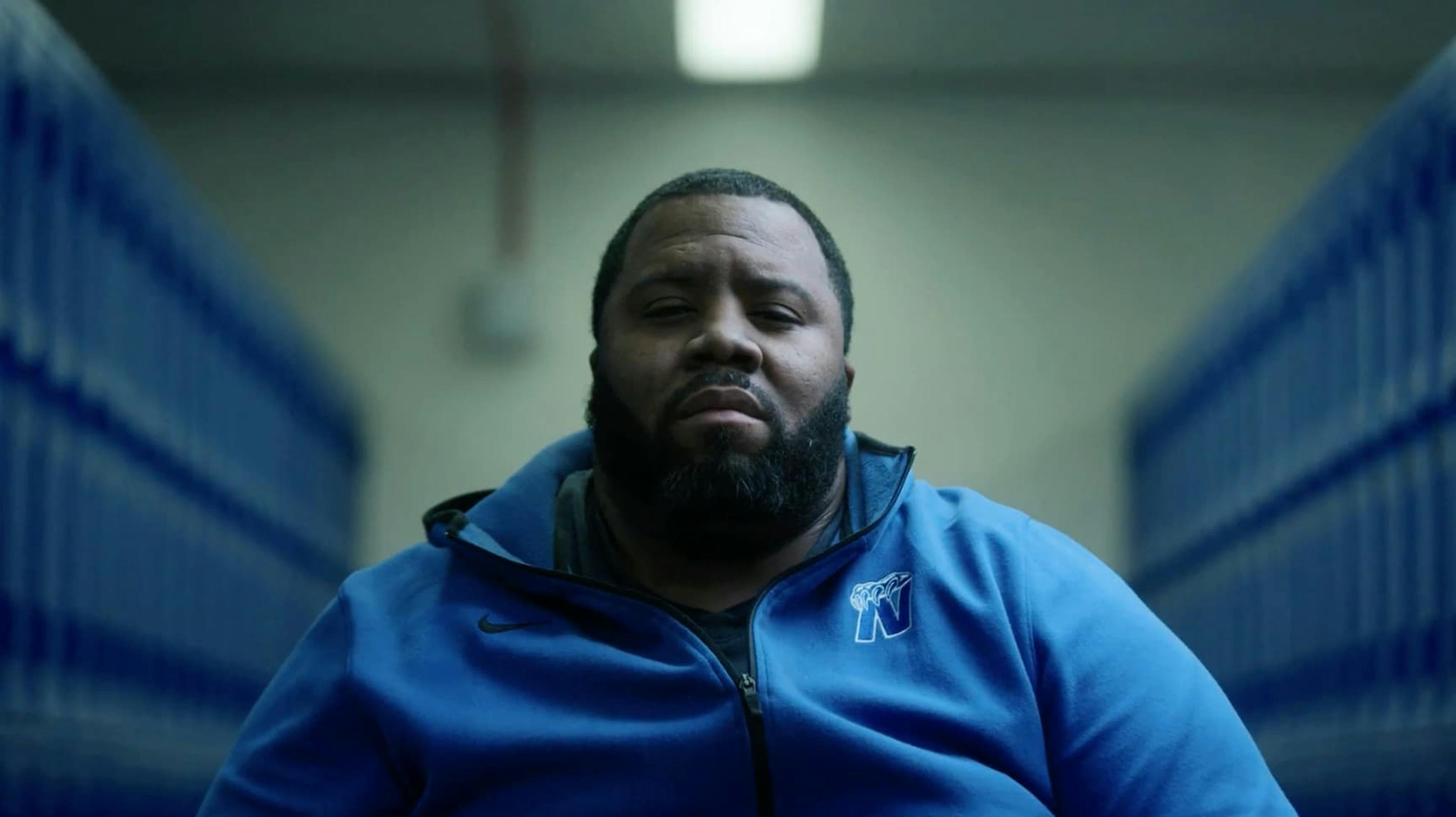 Man in hoodie with glum expression