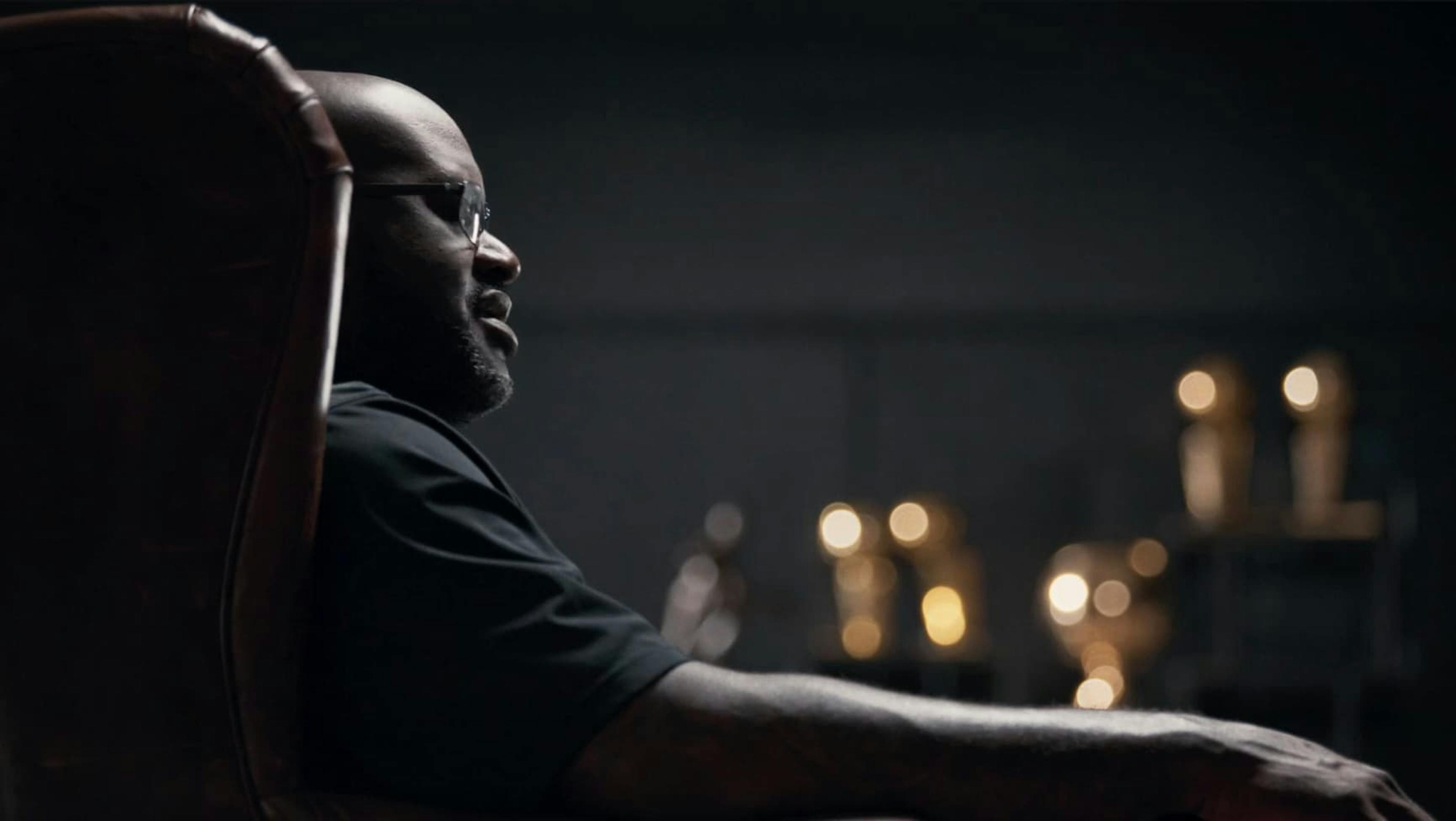 Side view of man sat in leather chair