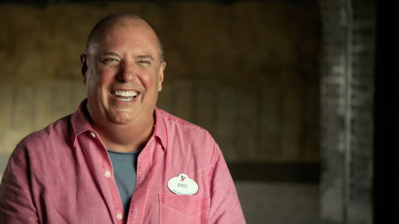 Man laughing whilst talking