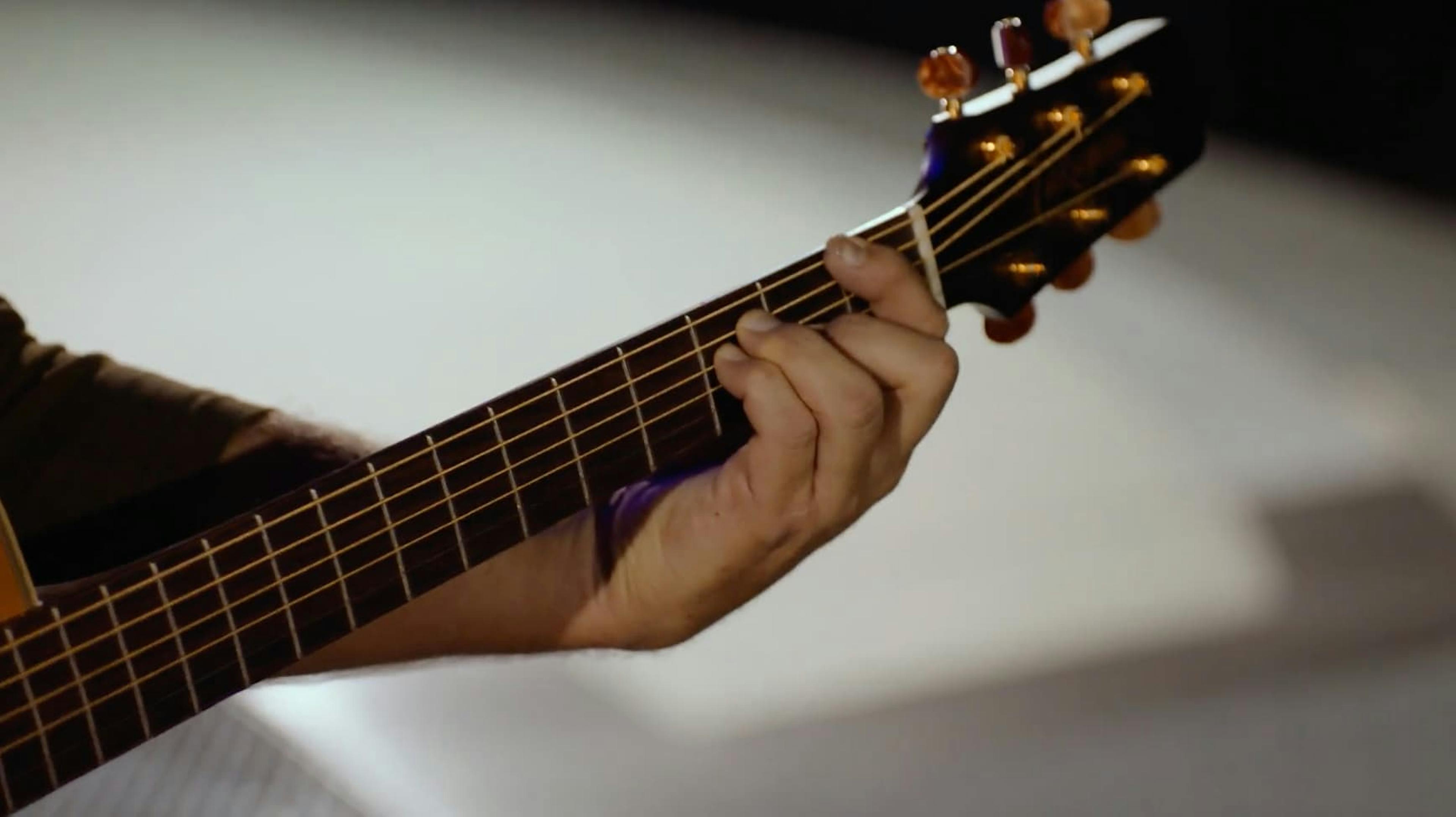 Arm playing guitar