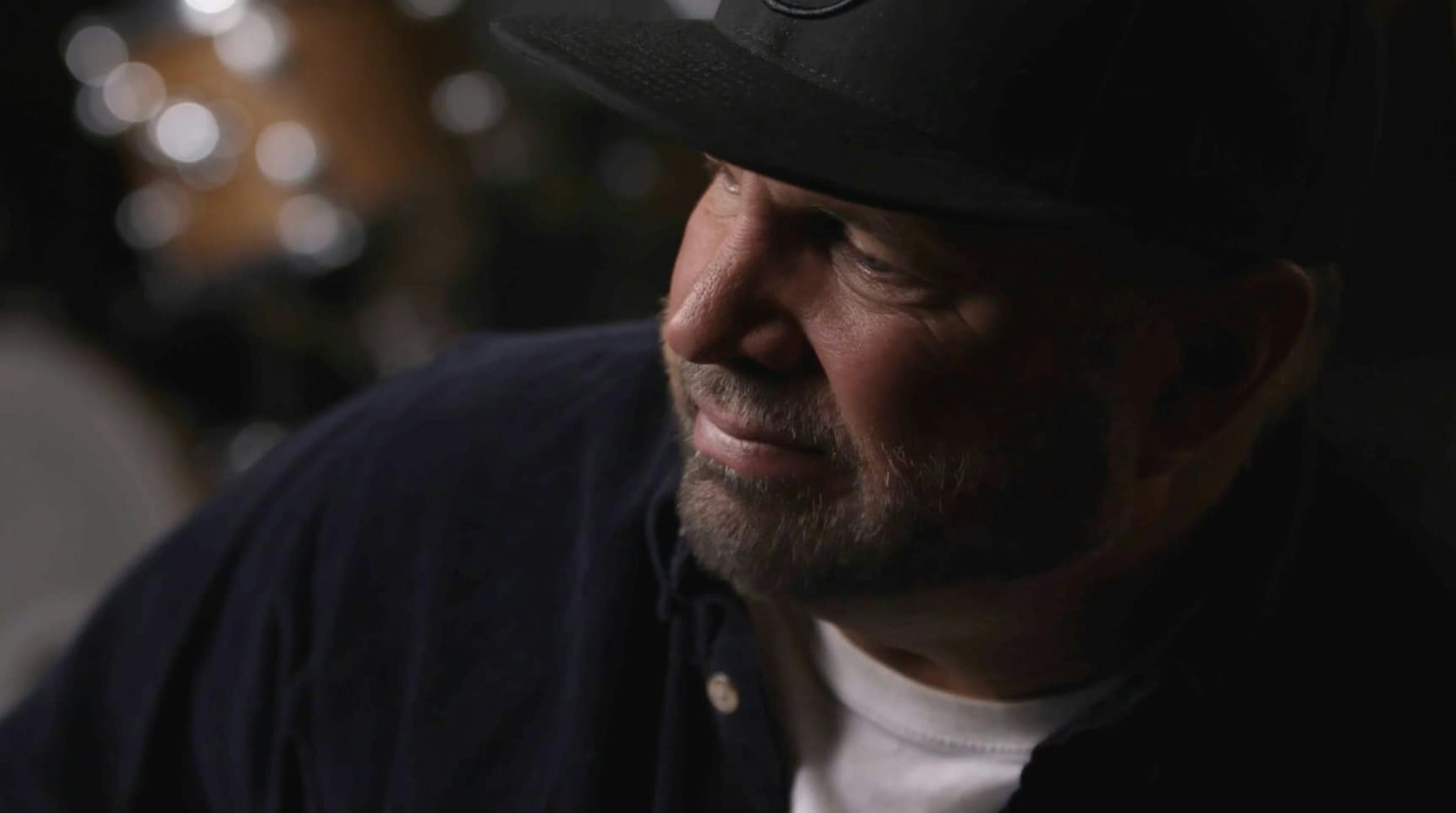 Up close side view of man wearing cowboy hat