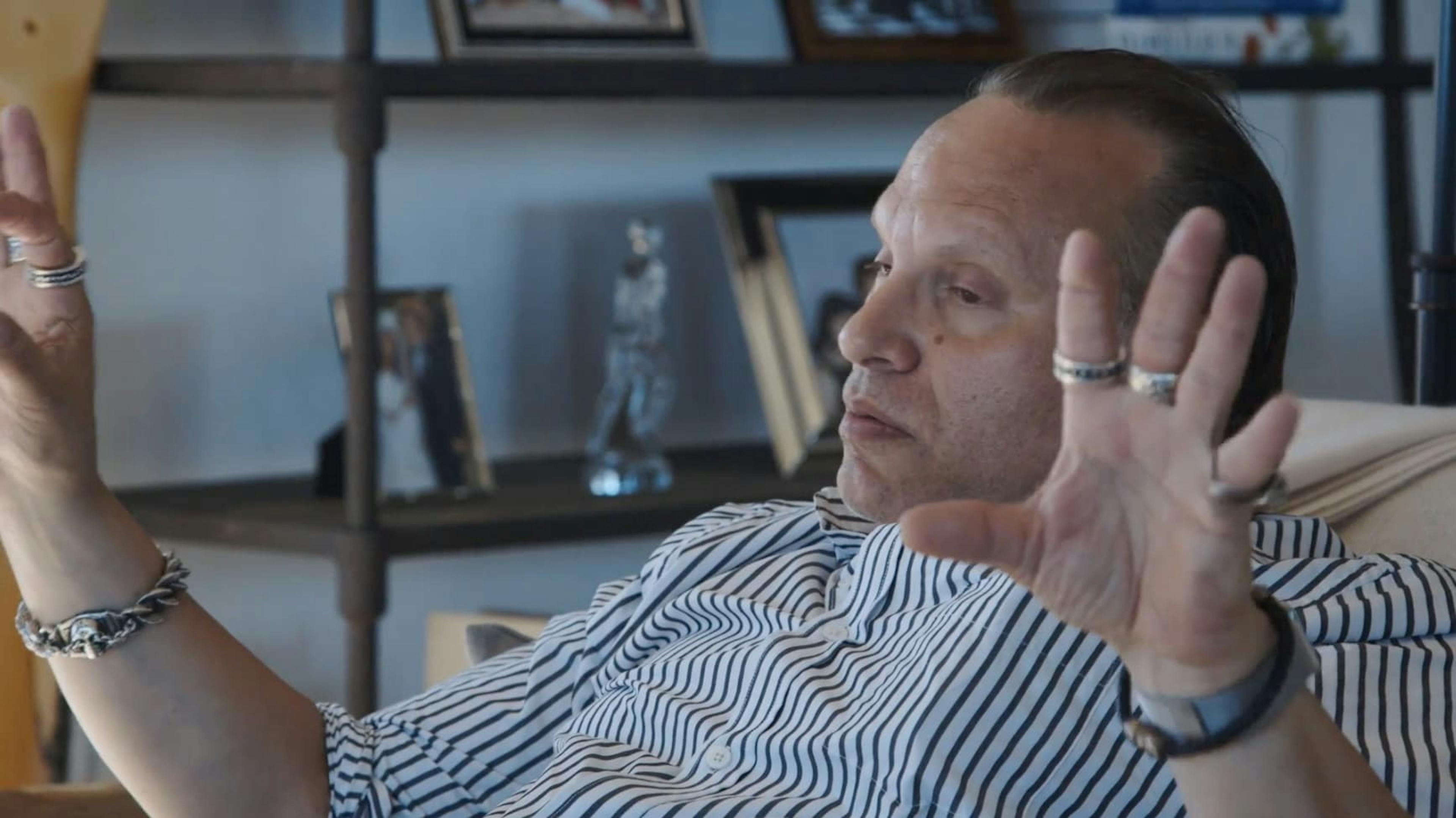 Man holding his hands up either side of him