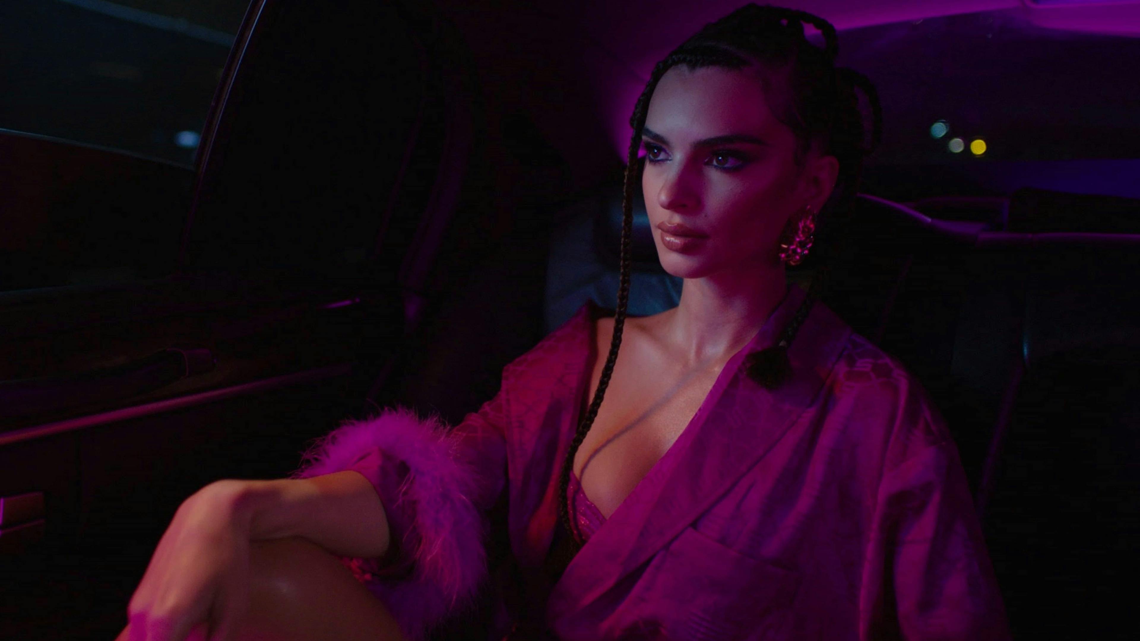 Girl sat in back of car in dim lighting