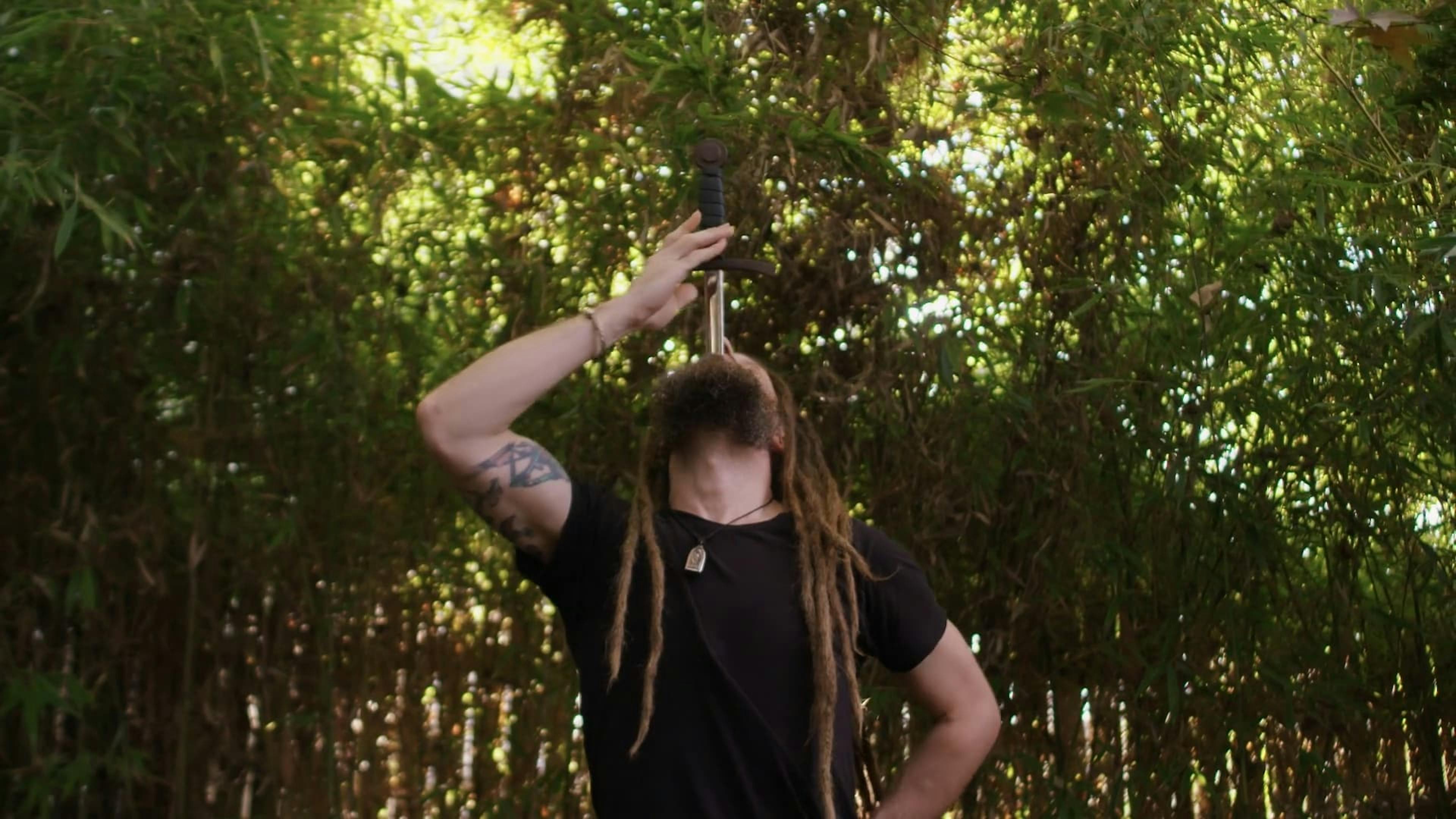 Man drinking something in forest