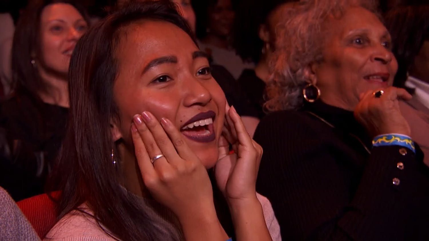 Girl with her hands on her cheek