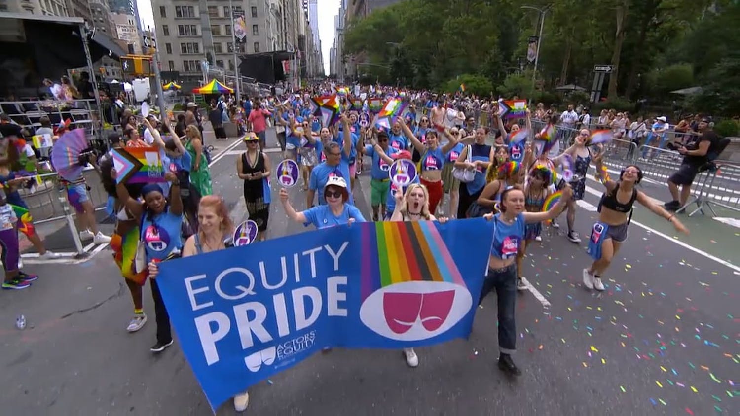 Crowd walking with banner that reads 'Equity Pride'