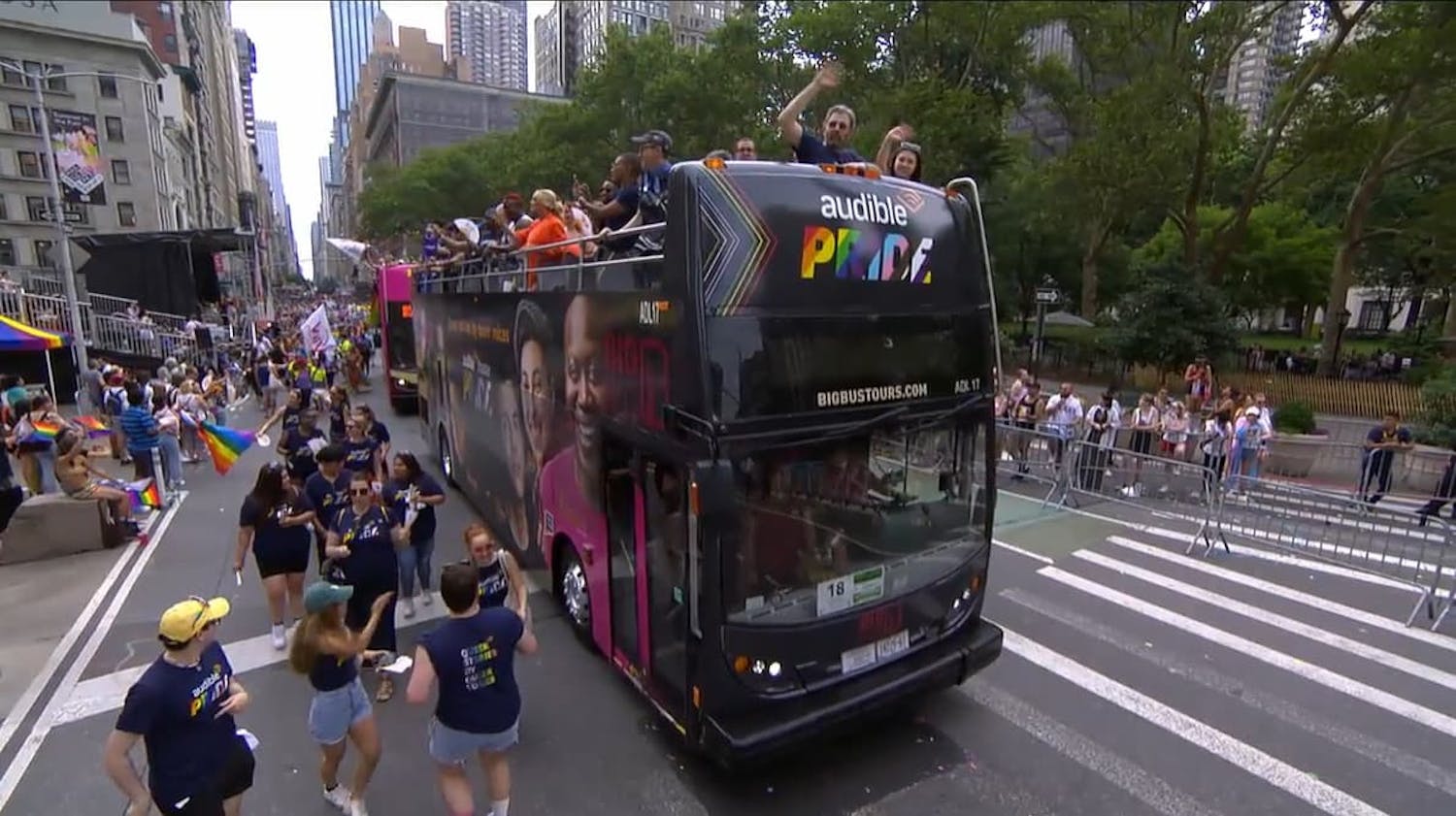 Bus driving through the pride march