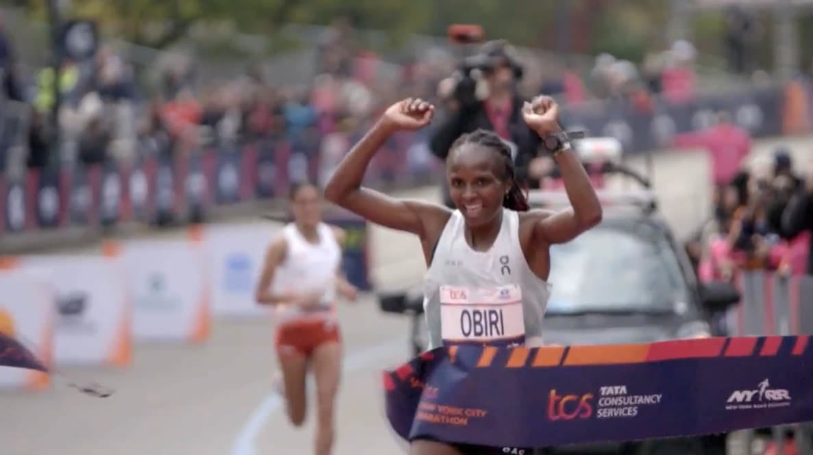 Runner crossing the marathon finish line