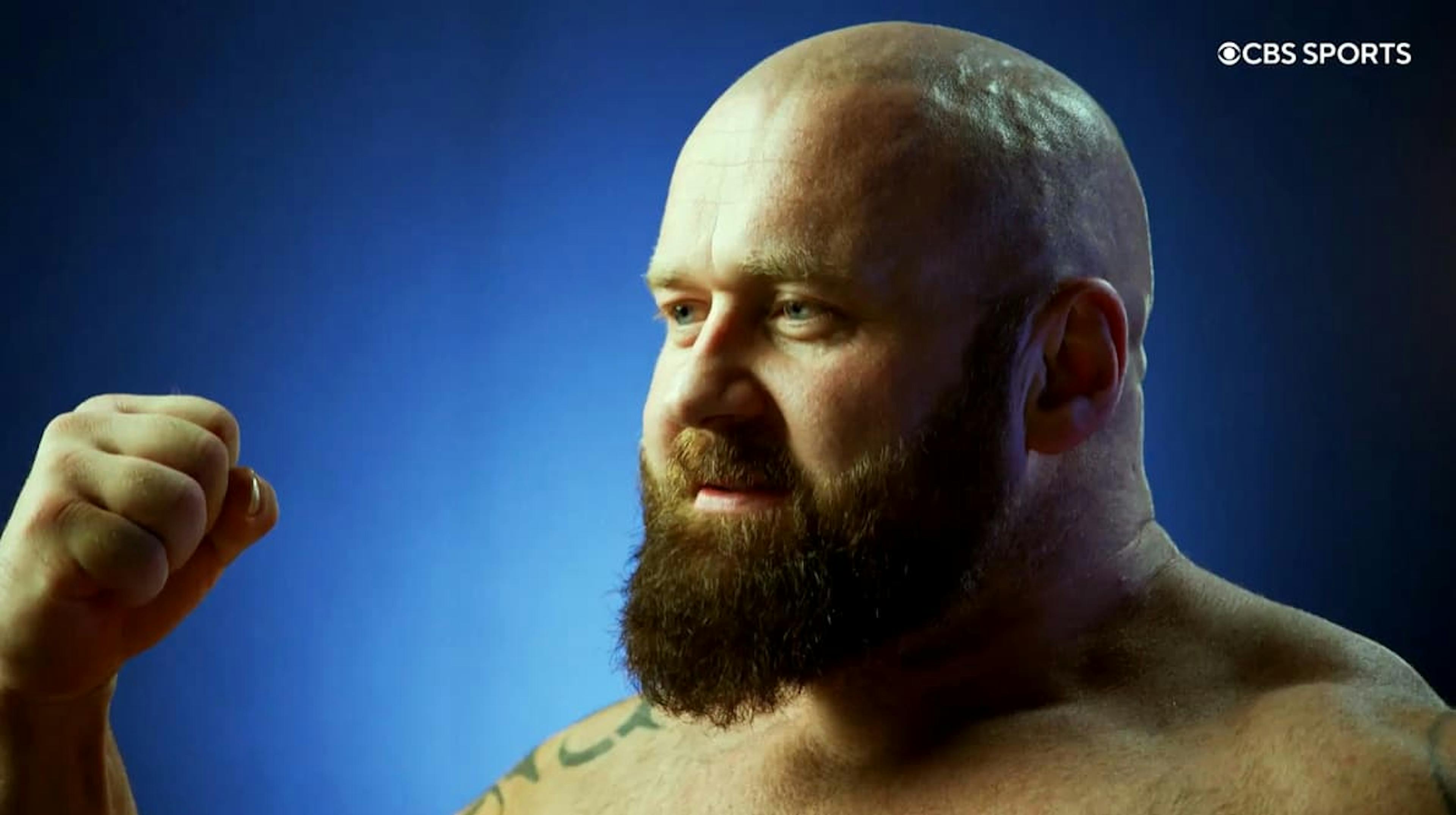 Man clenching his arm