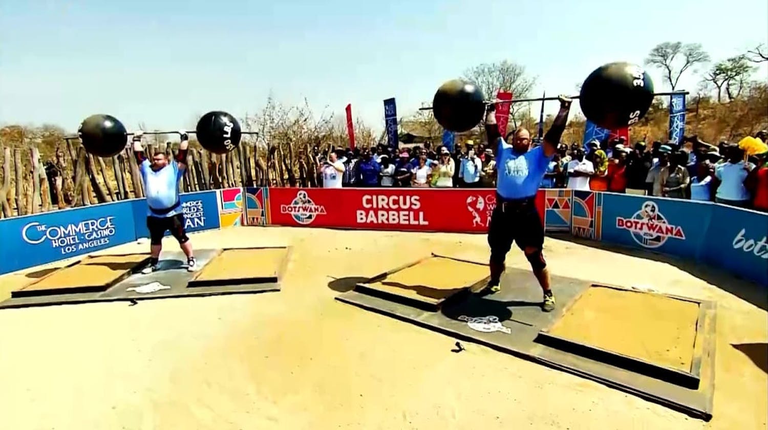 Two men lifting weights