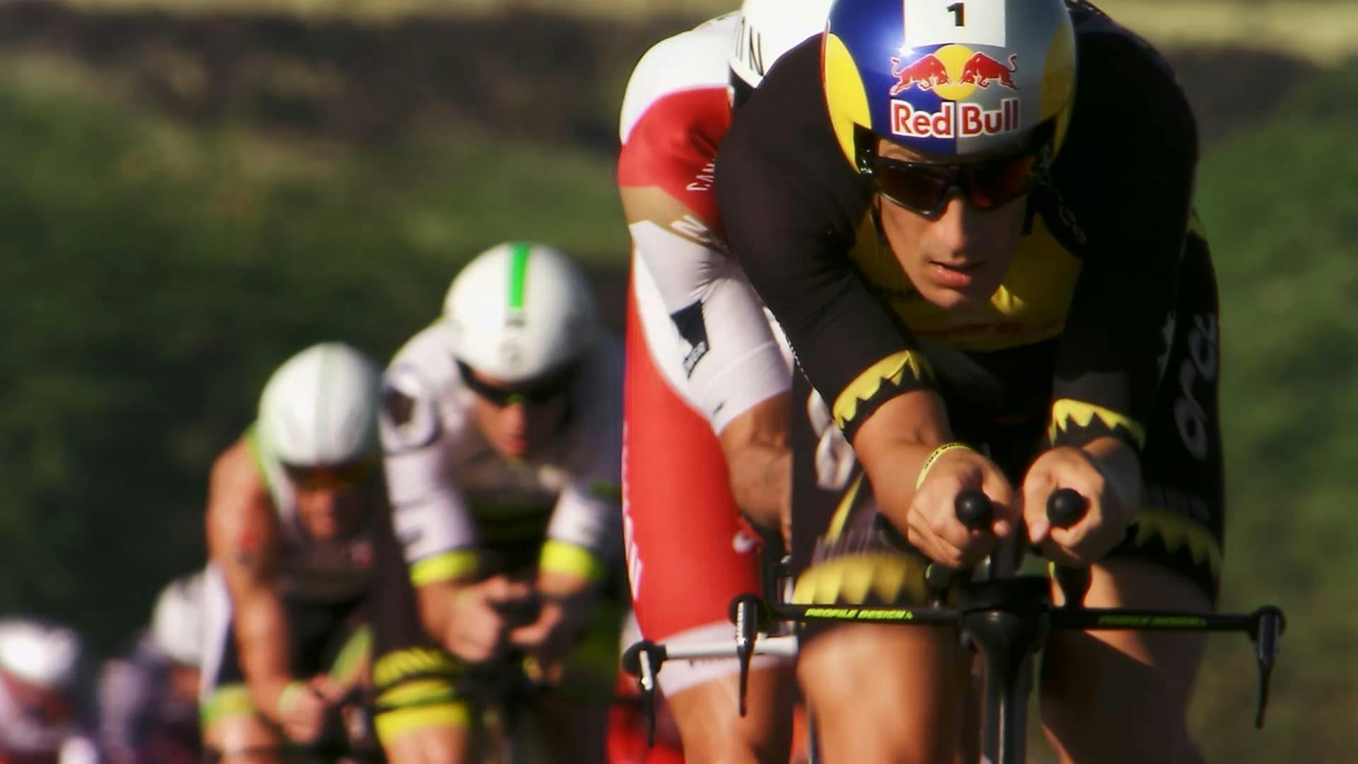 Cyclists riding bike in a row