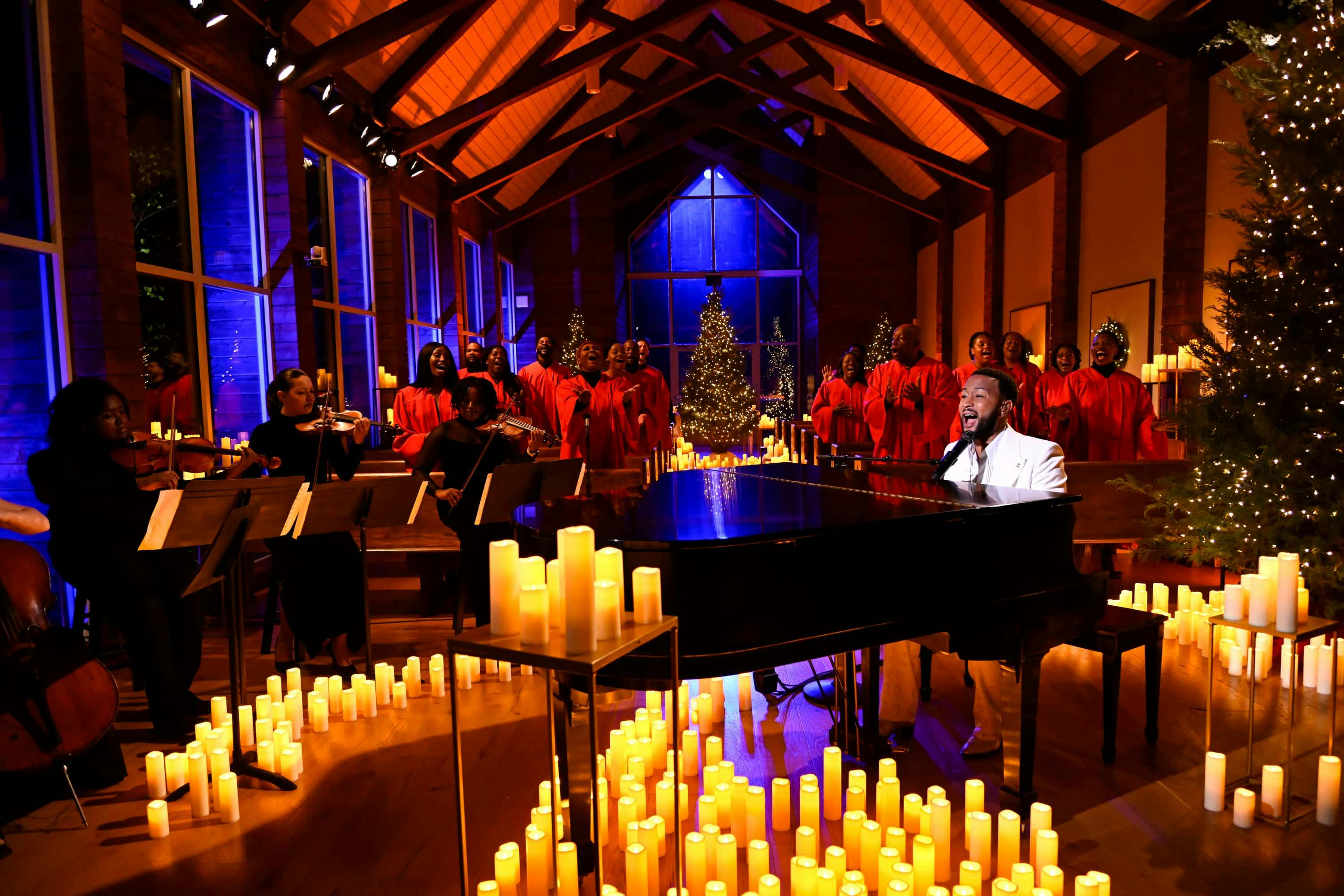 John Legend playing piano with choir singing