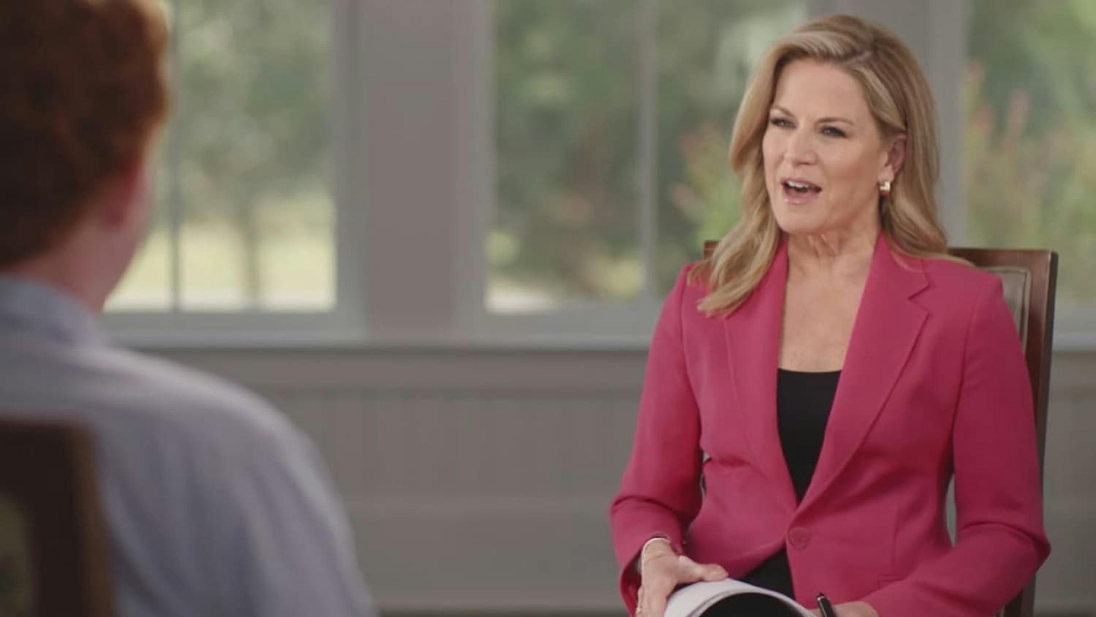 Woman interviewing man