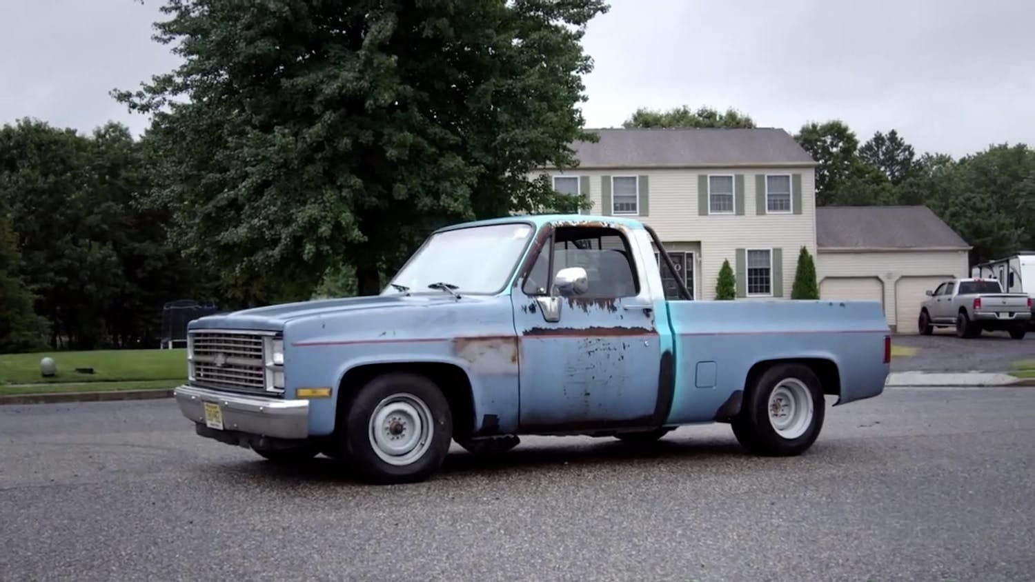 Old blue truck on road