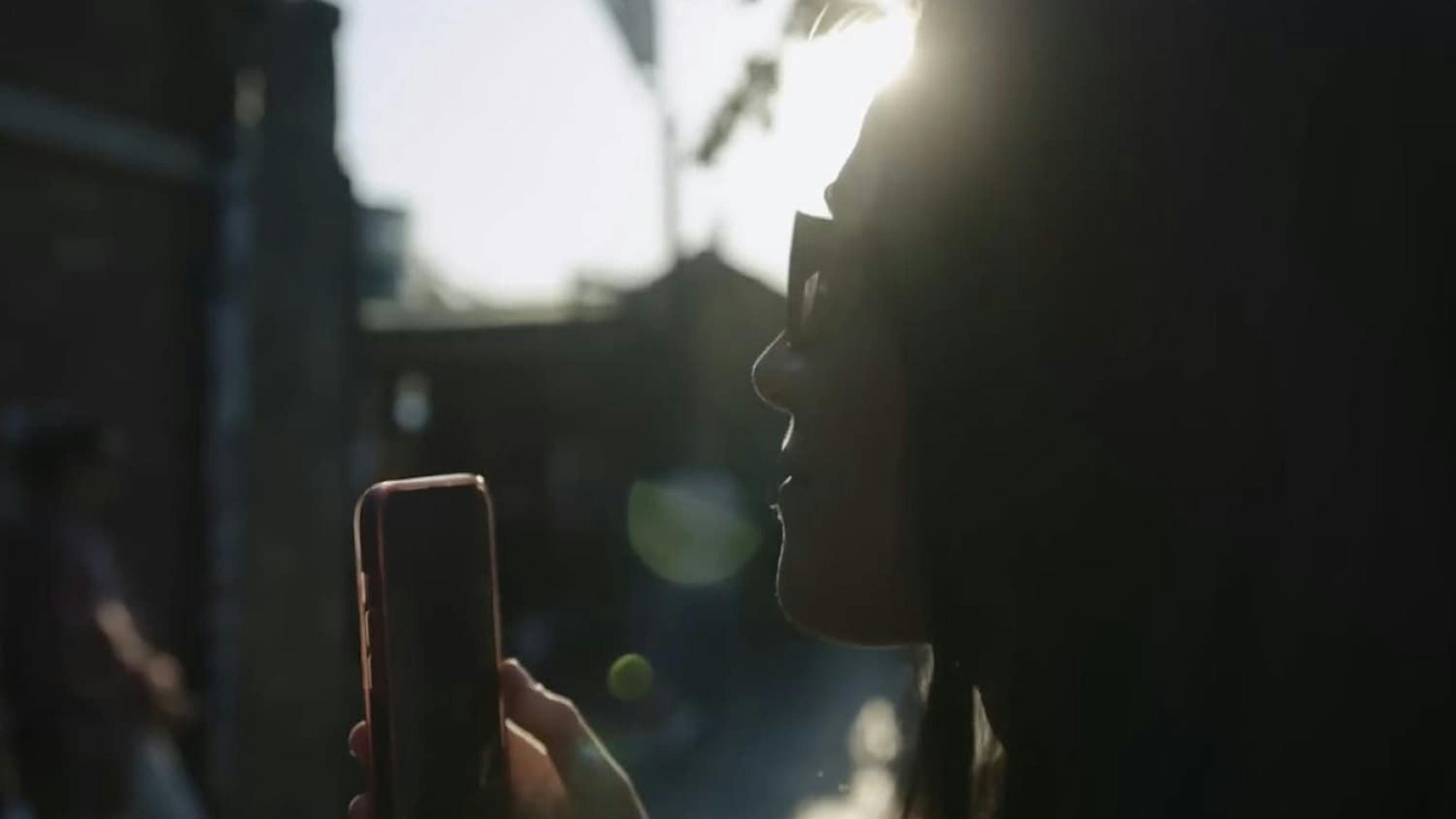 Close up of woman stood in sun