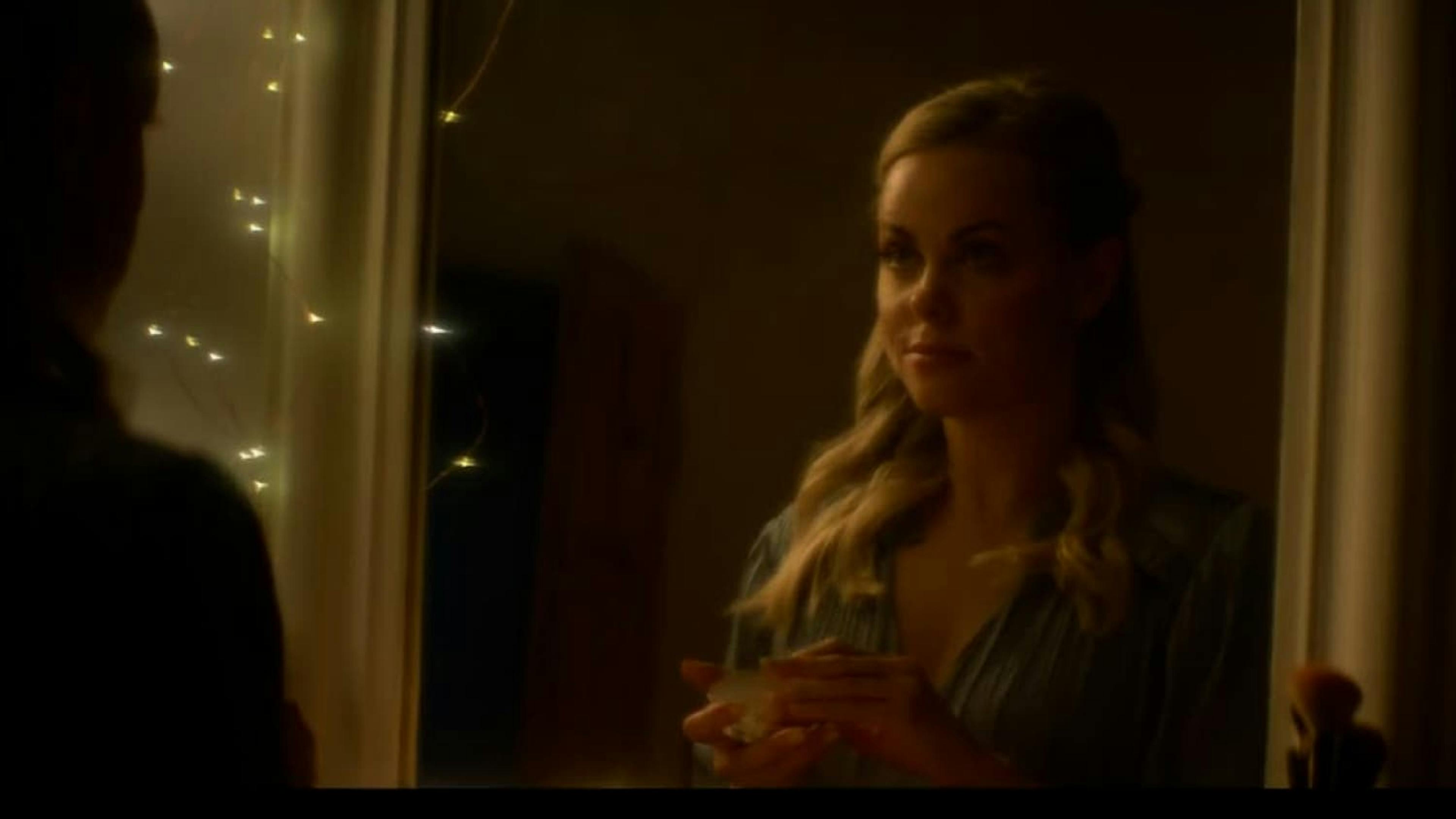 Woman looking in mirror