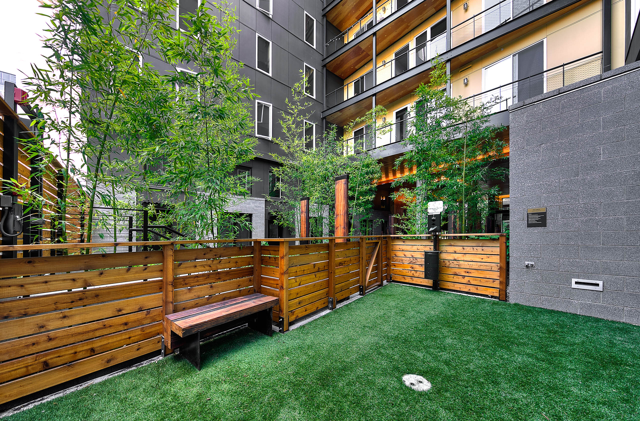 Second outdoor Pet Run with brown fencing bench at AMLI South Lake Union
