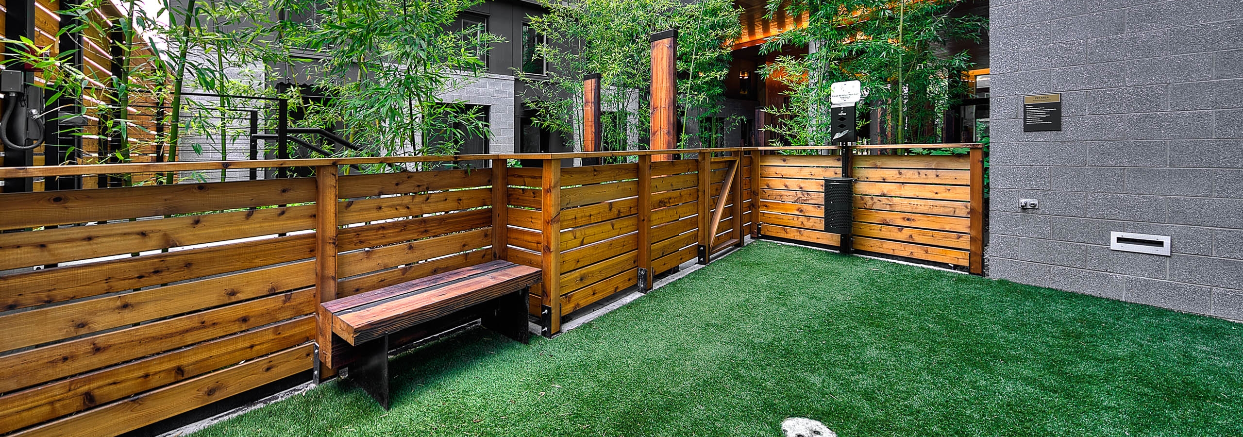 Second outdoor Pet Run with brown fencing bench at AMLI South Lake Union