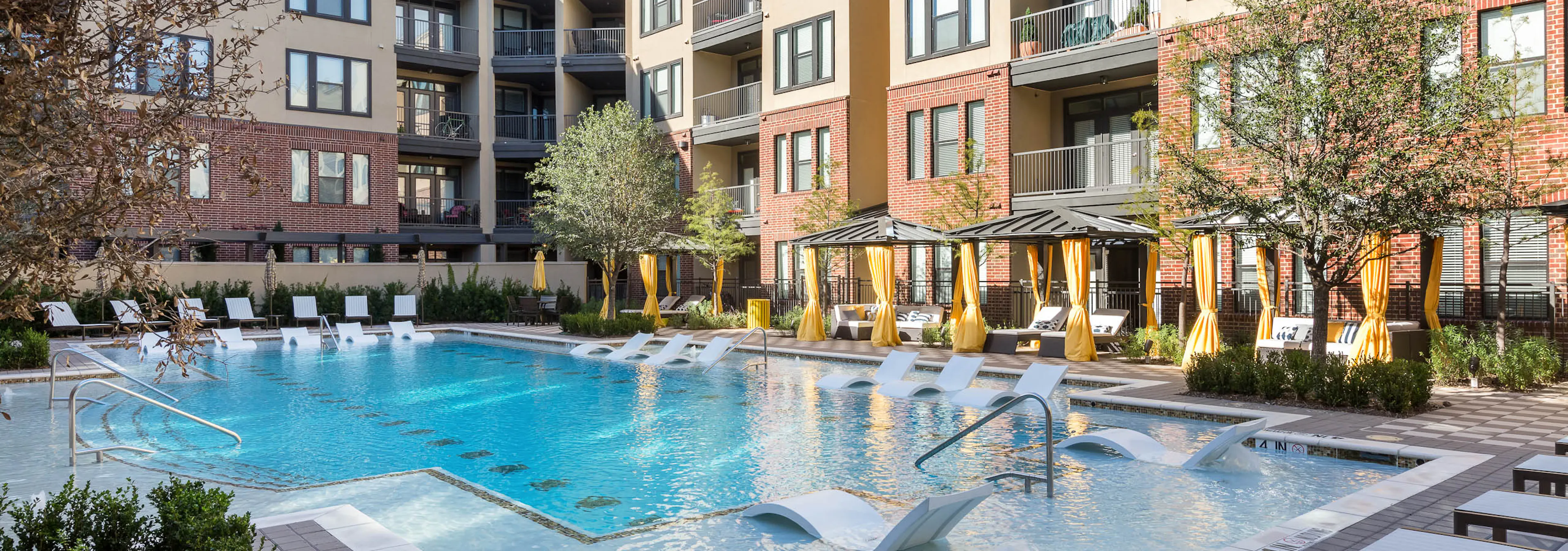 AMLI West Plano pool during the day with blue water