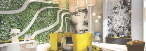 Leasing office at AMLI Park West with a living green wall, desk and chairs, and cylindrical light fixture