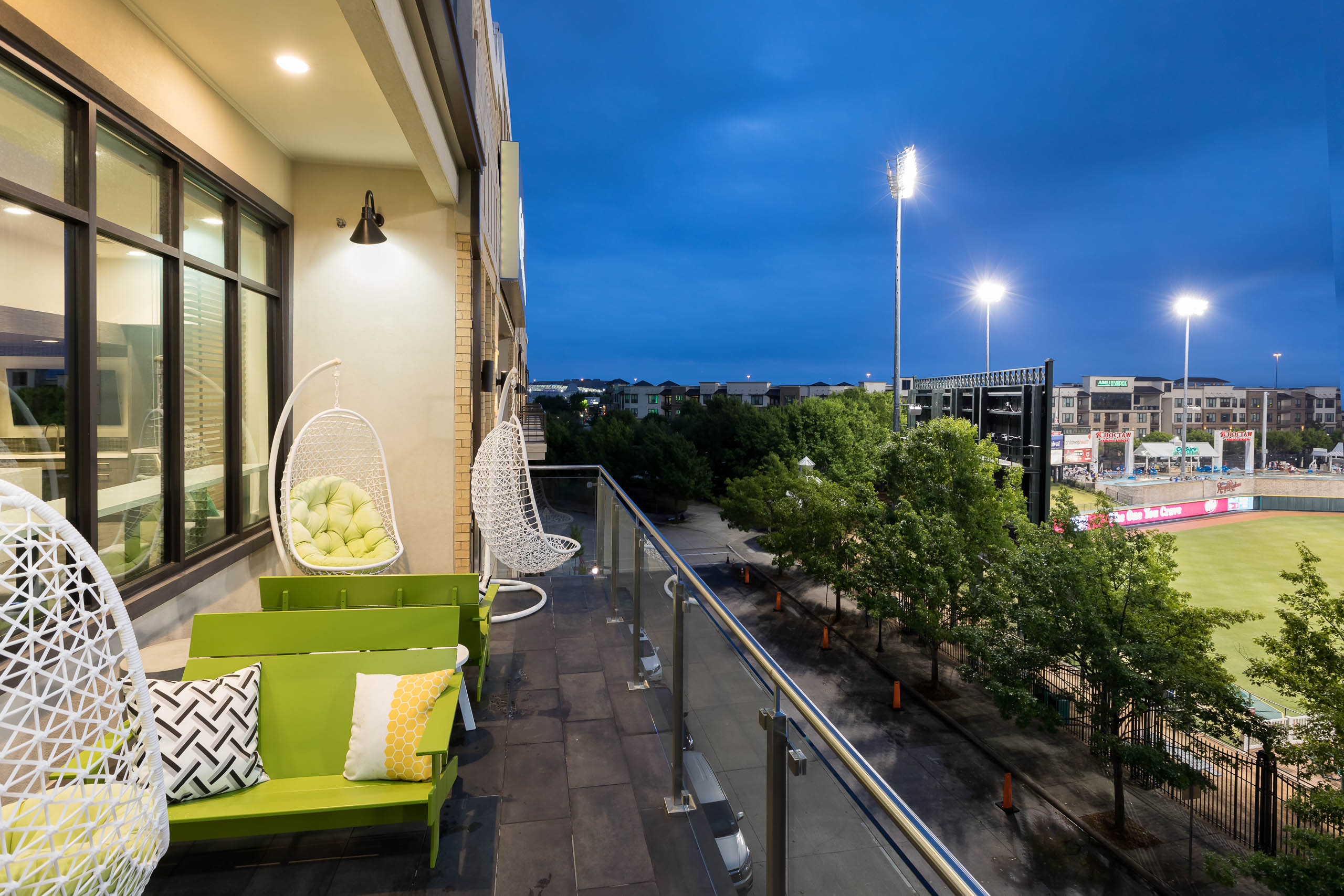 AMLI Frisco Crossing apartments sky suite balcony with a view of the ballpark at night