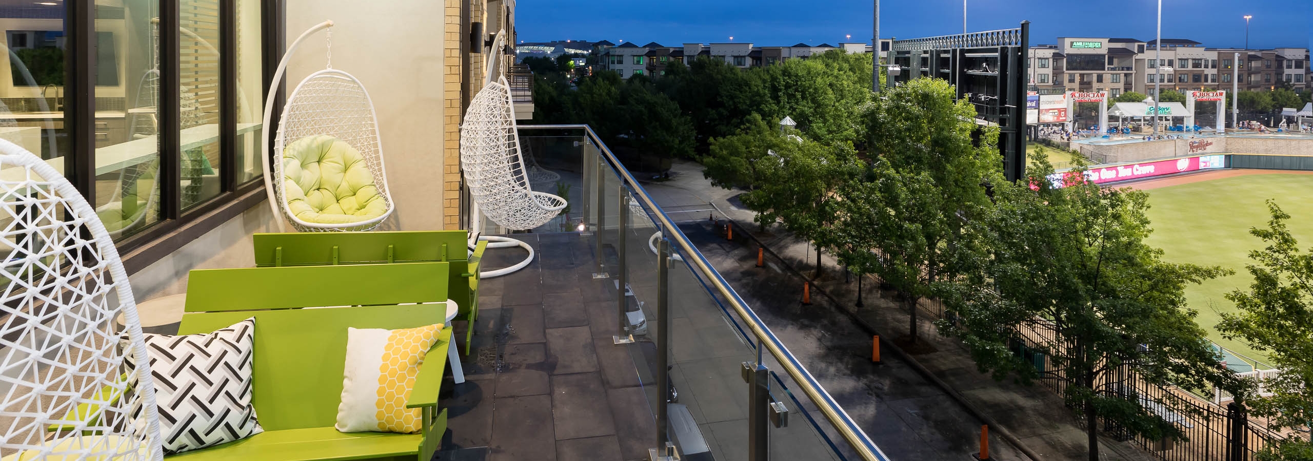 AMLI Frisco Crossing apartments sky suite balcony with a view of the ballpark at night