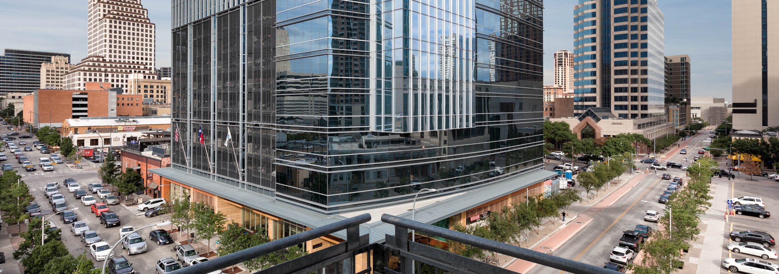 AMLI Downtown apartment balcony view with large office building in foreground