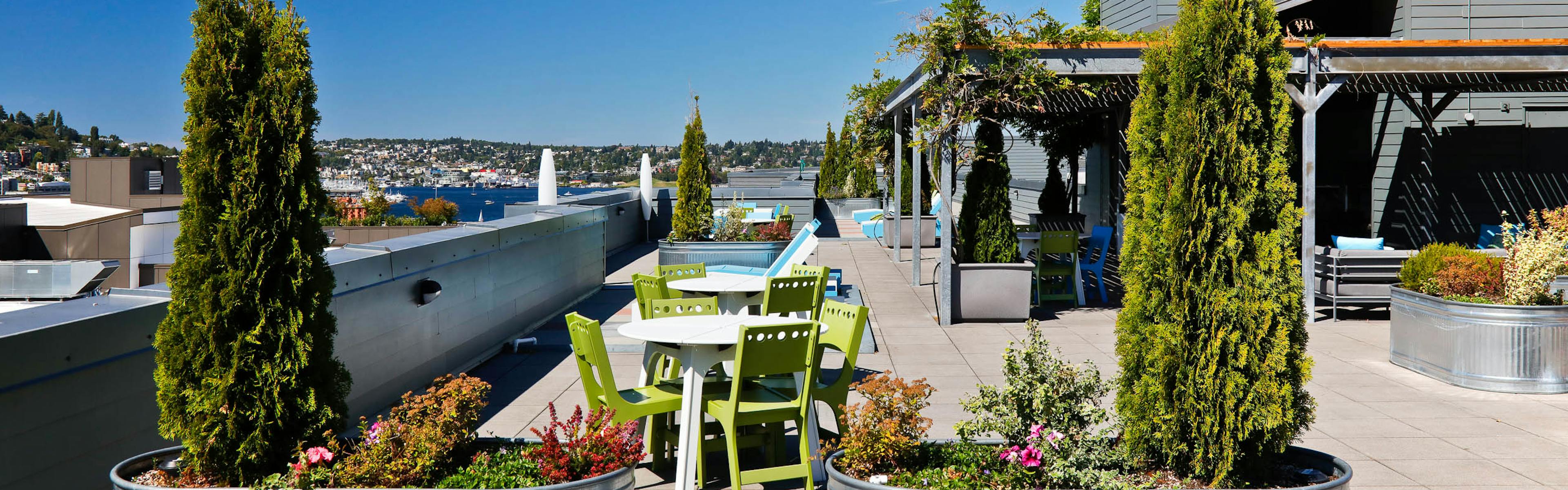 Rooftop View from AMLI 535 in South Lake Union on a sunny day in Seattle with outdoor patio furniture