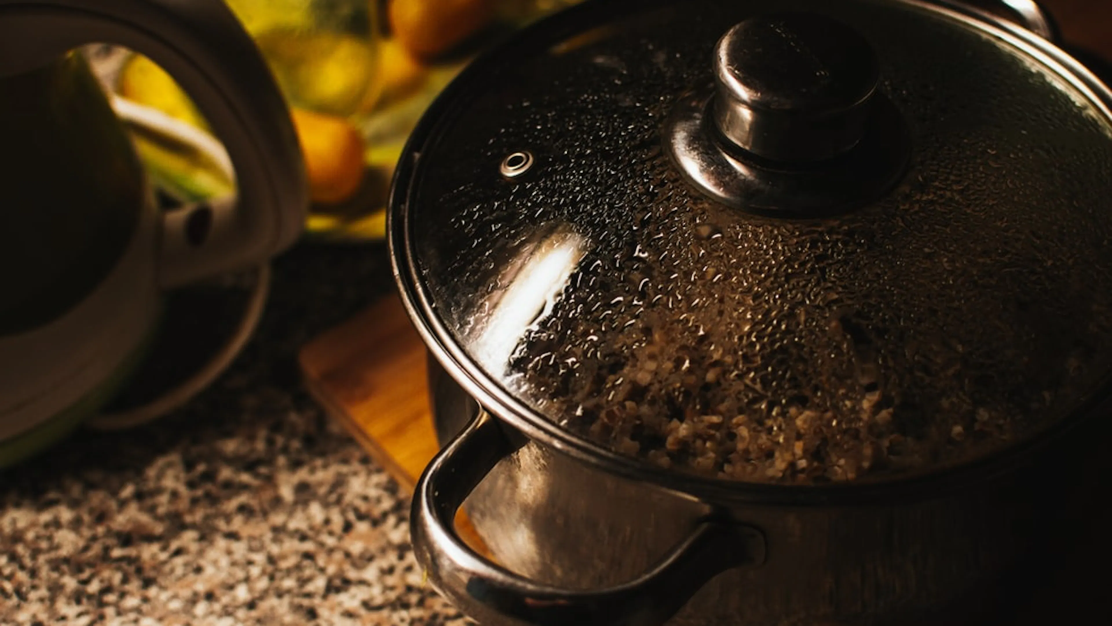 A close up picture of a cooking pot with rice inside  
