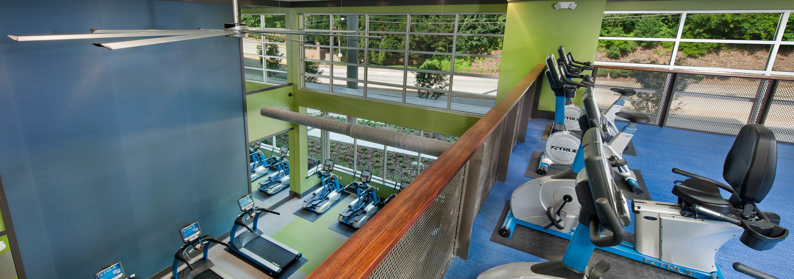 AMLI Piedmont Heights upstairs fitness center with spin bikes overlooking the first floor of treadmills and weight machines