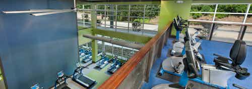 AMLI Piedmont Heights upstairs fitness center with spin bikes overlooking the first floor of treadmills and weight machines