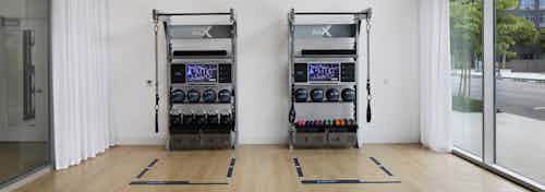Interior of group studio with on demand fitness classes and a variety of workout equipment at AMLI Park Broadway apartments