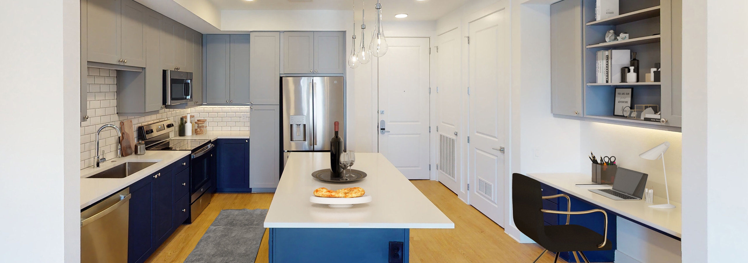 AMLI Branch Park apartment kitchen featuring stainless steel appliances and a blue kitchen island with white countertops
