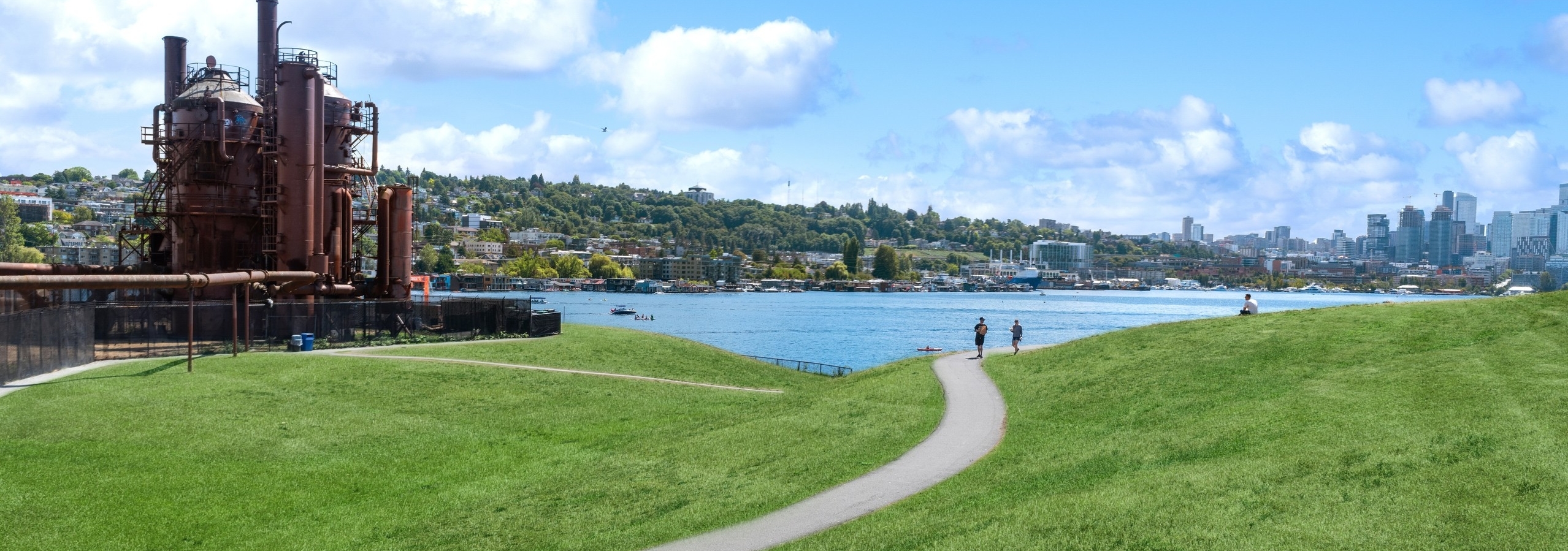Neighborhood view near AMLI Wallingford with grassy areas and cement walkway and blue skies and a view of Lake Union