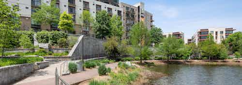 View of AMLI Old 4th Ward just steps away from Historic Old 4th Ward Park with luscious landscaping with walkways and pond