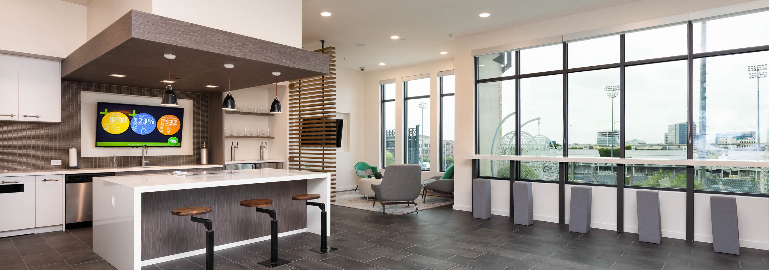 Interior of skybox suite overlooking Dr Pepper Ballpark at AMLI Frisco Crossing apartment building with serving kitchen