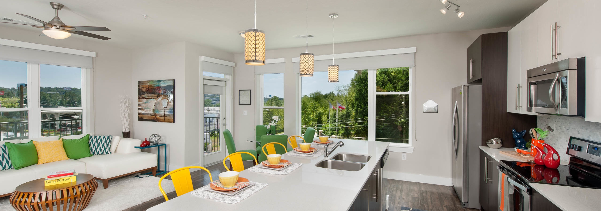 AMLI Piedmont Heights large kitchen island with multiple windows for natural sunlight and stainless steel appliances