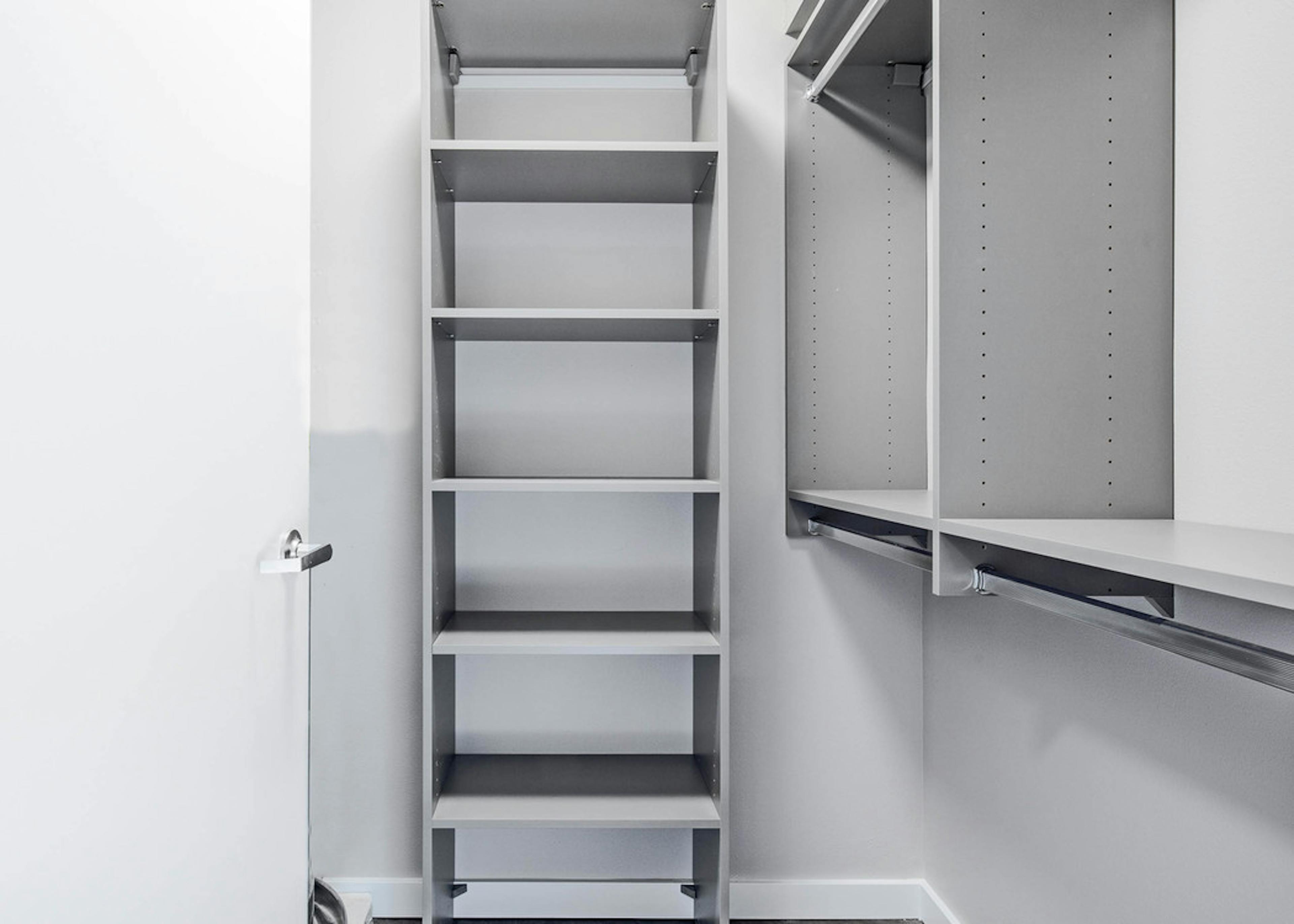 Interior view of upgraded California closet at AMLI Bellevue Park with ample amount of space for clothes and shoes 