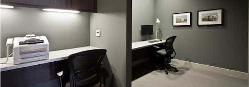 Interior of the business center at AMLI South Lake Union apartments with computers, a printer and nice seating