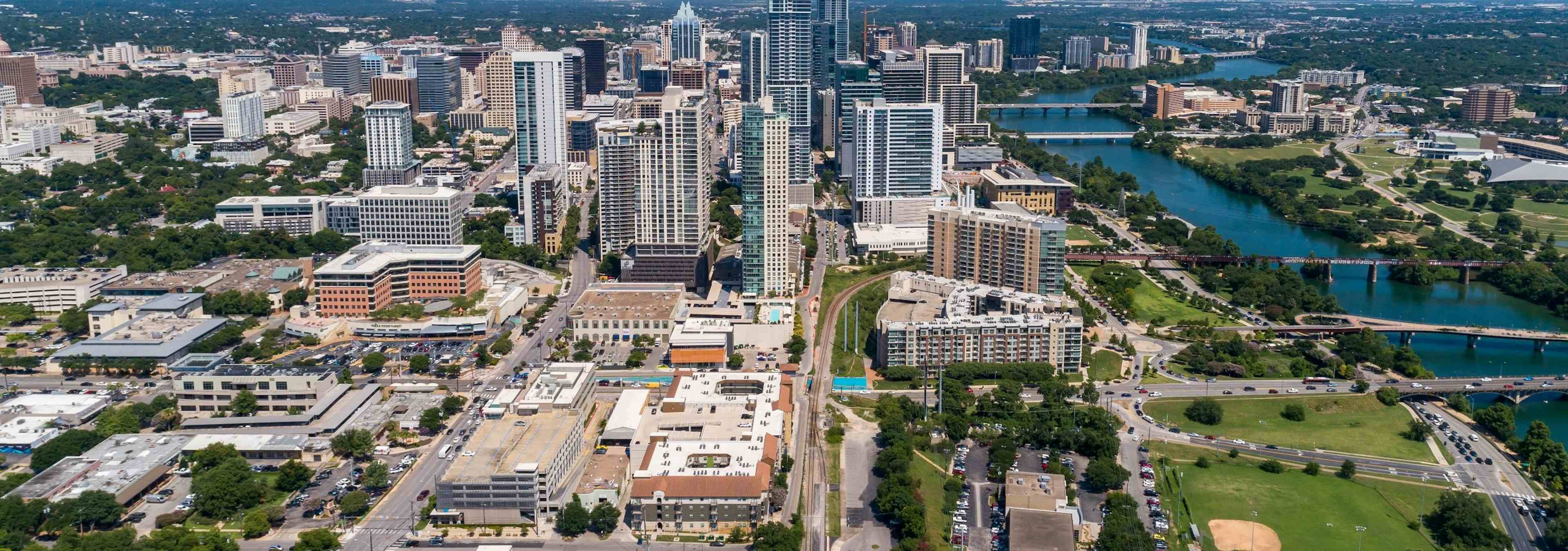 Aerial view of the Austin downtown skyline and river near AMLI 300