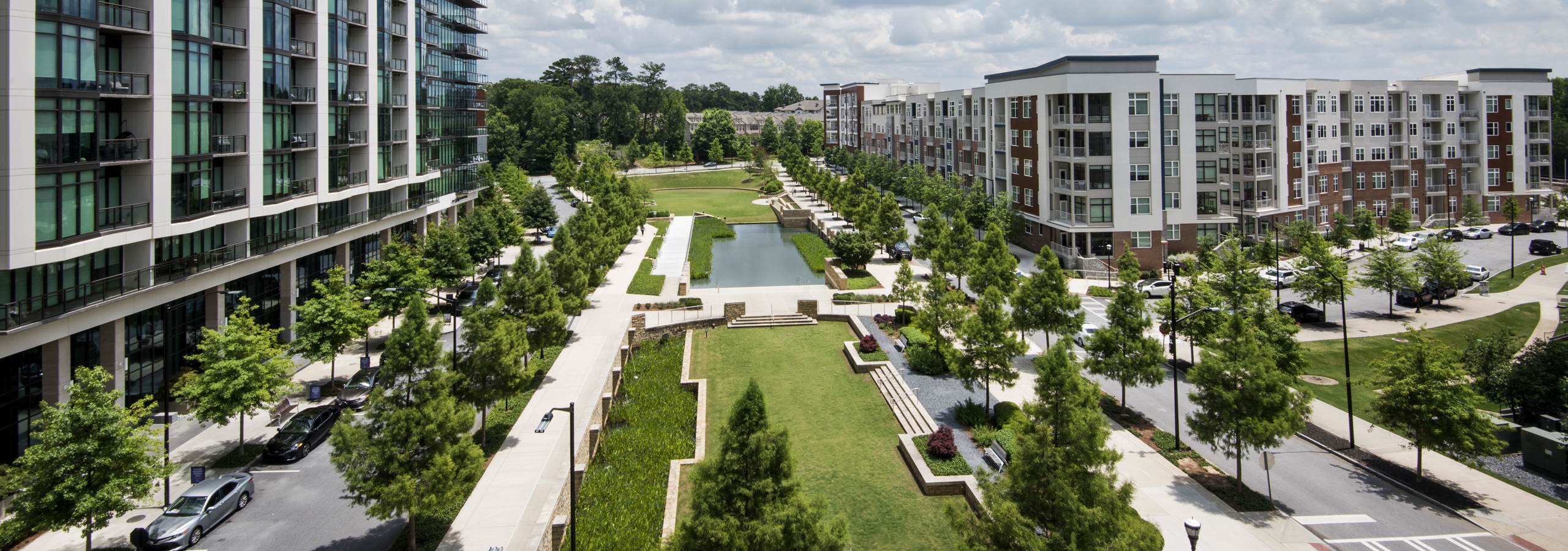 Overhead view of Marie Sims Park and tree lined streets with AMLI 3464 on the left and AMLI Buckhead on the right