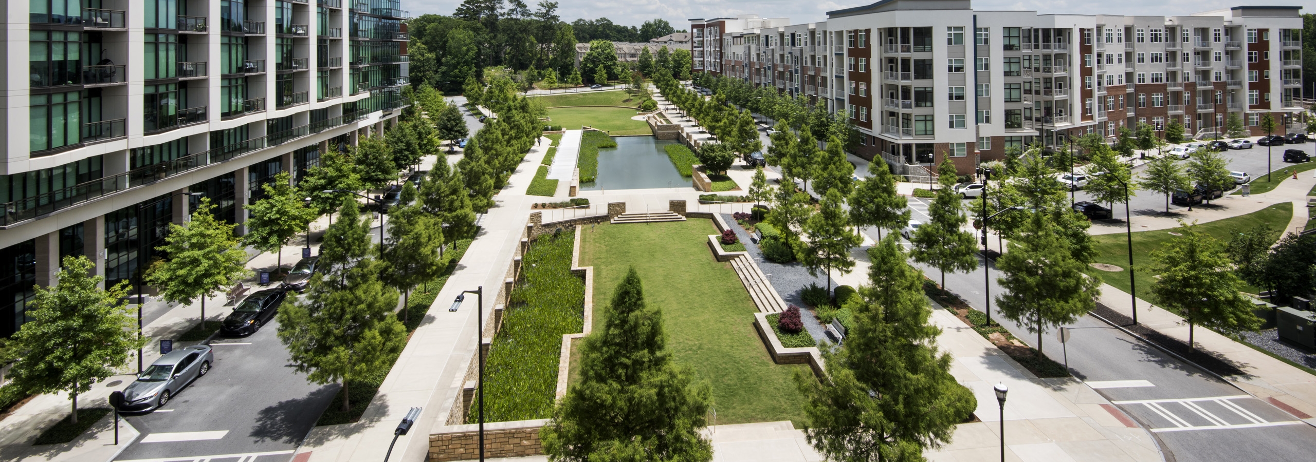 Overhead view of Marie Sims Park and tree lined streets with AMLI 3464 on the left and AMLI Buckhead on the right