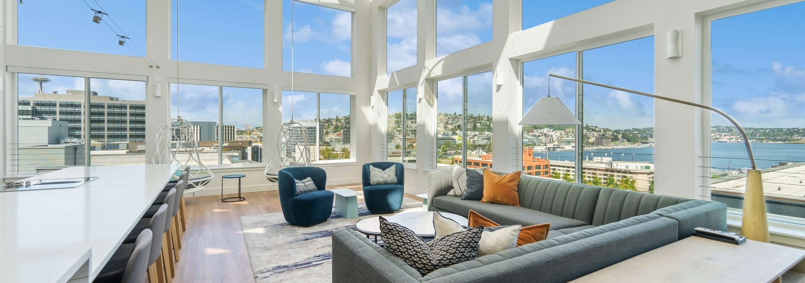Solarium at AMLI South Lake Union with high ceilings and huge windows with scenic views and seating areas and a long island