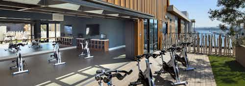 AMLI Marina Del Rey apartment yoga deck on the fifth floor with spin bikes and meditation lawn overlooking the sunny marina