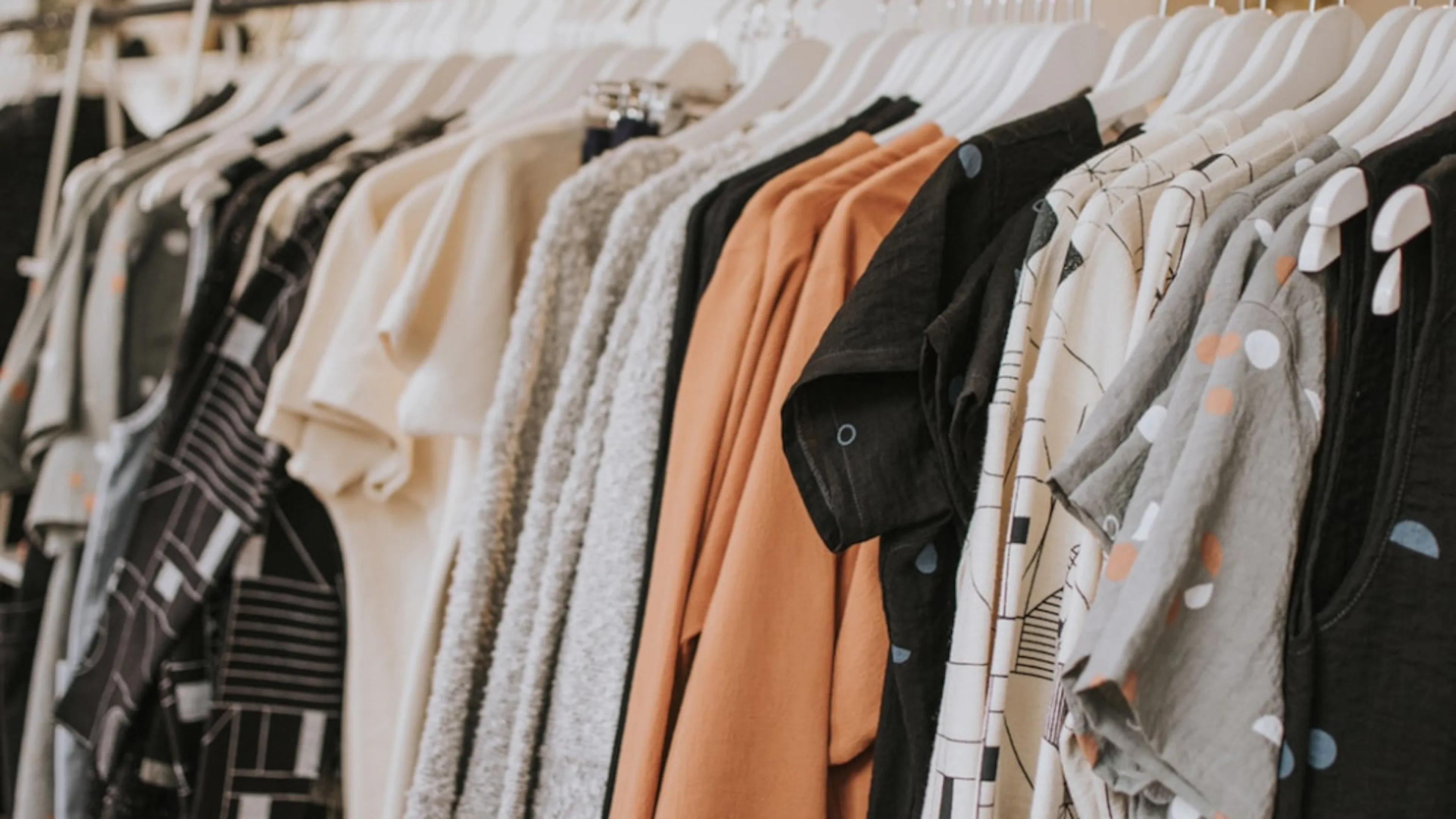 Thrift store clothes on rack