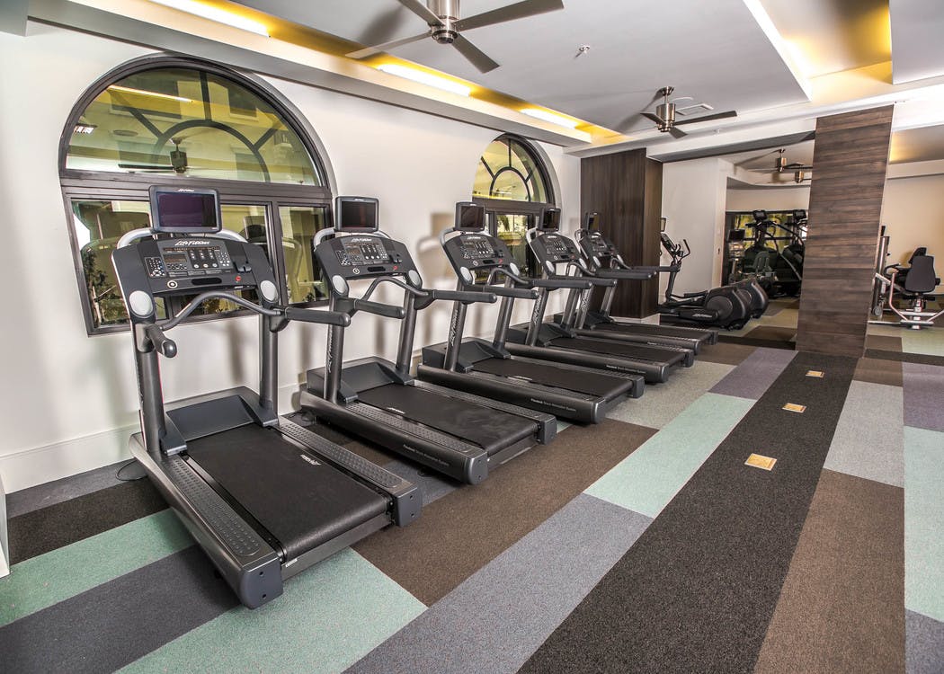 Interior of the state of the art fitness center at AMLI Joya with treadmills, weight machines and endurance equipment