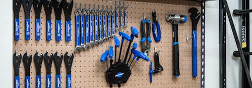 Interior view of the bike repair room at AMLI Arista apartments showcasing a close up view of the work bench with the tools