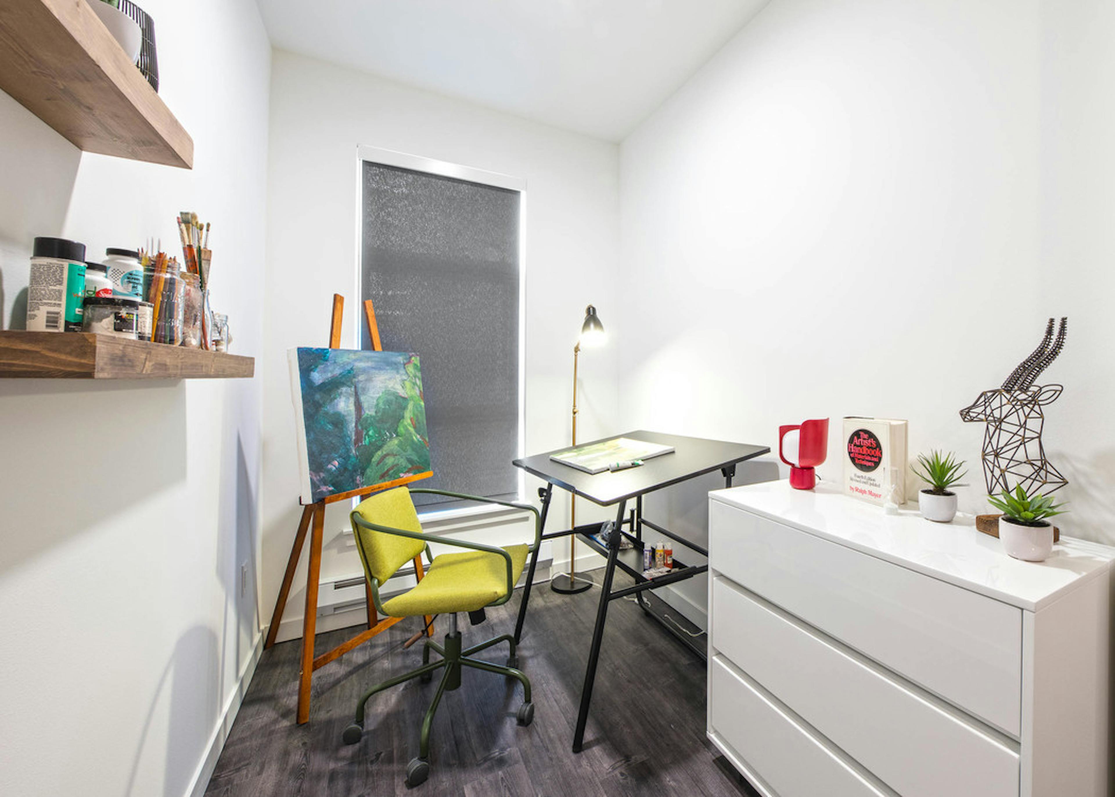 Interior apartment at AMLI Wallingford with view of bedroom with art space black out curtains and white dresser 