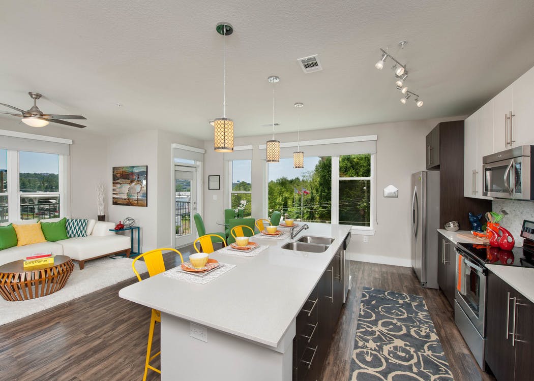 AMLI Piedmont Heights large kitchen island with multiple windows for natural sunlight and stainless steel appliances